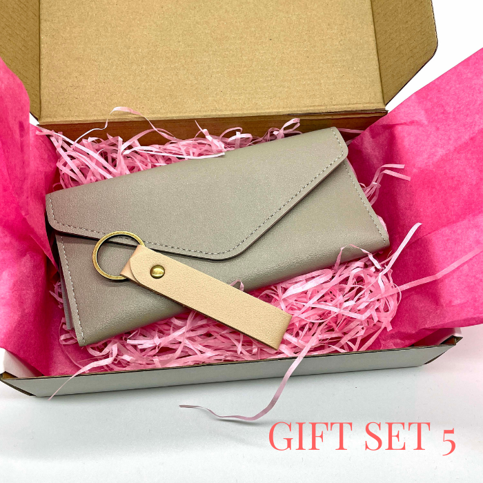 Silver Mist leather wallet and leather keychain beautiful packed in a gift box with pink tissue paper and tissue shreds.