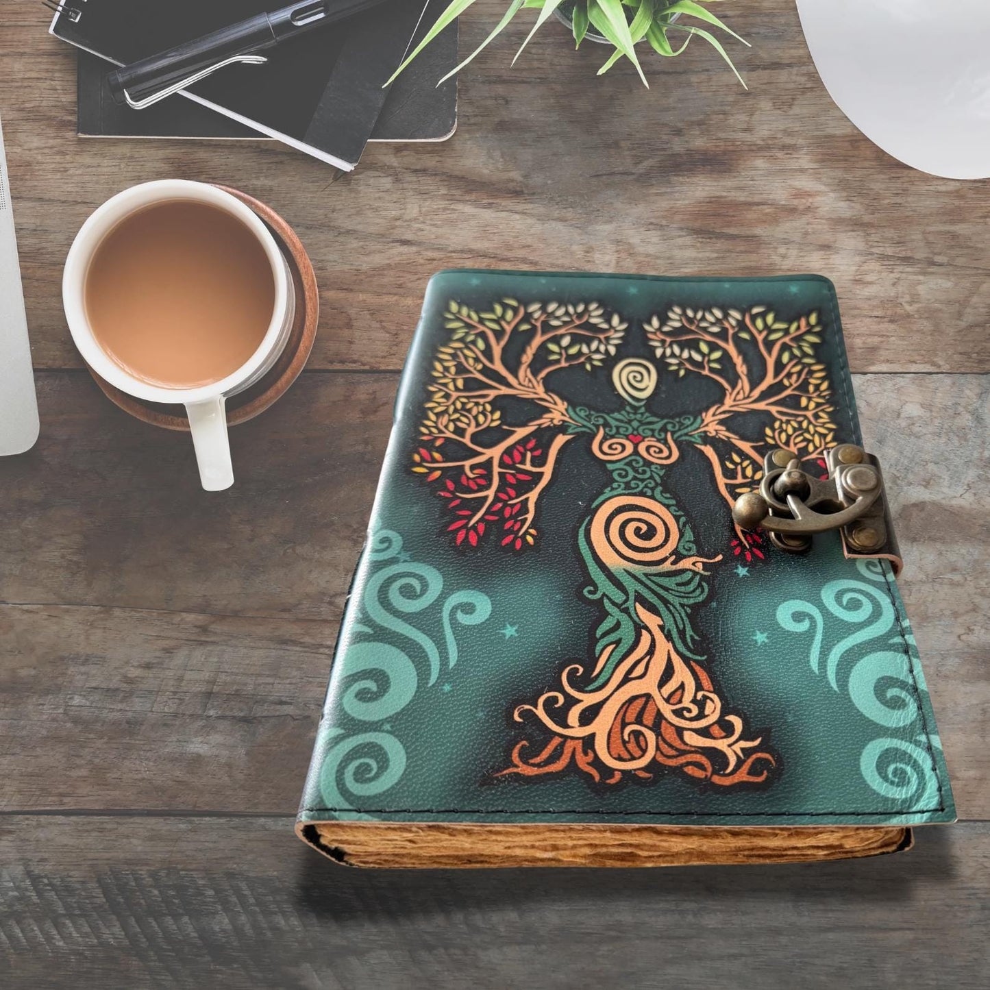 Book Of Shadows Journal on an asthetic wooden table.