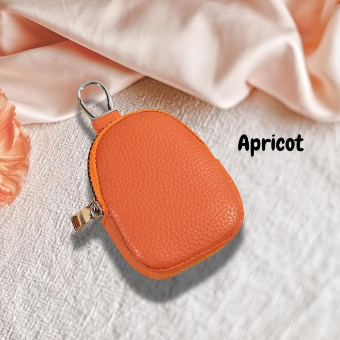 Coin pouch in the colour apricot orange