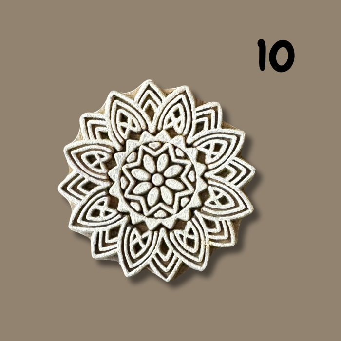 Flower wooden stamp on a beige background