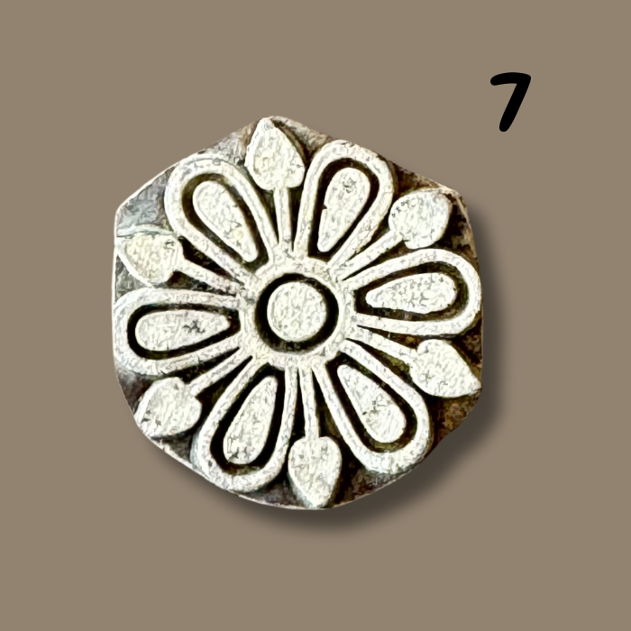 Elva wooden printing block on a beige background