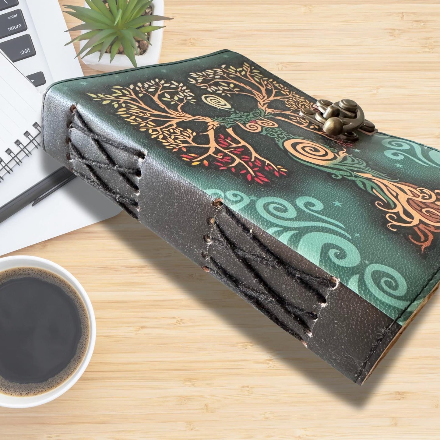 Embossed leather journal on aa asthetic wooden desk