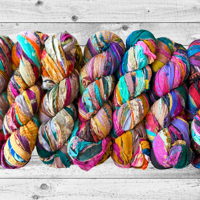Embroidered Silk Chiffon Ribbon on a grey wooden background