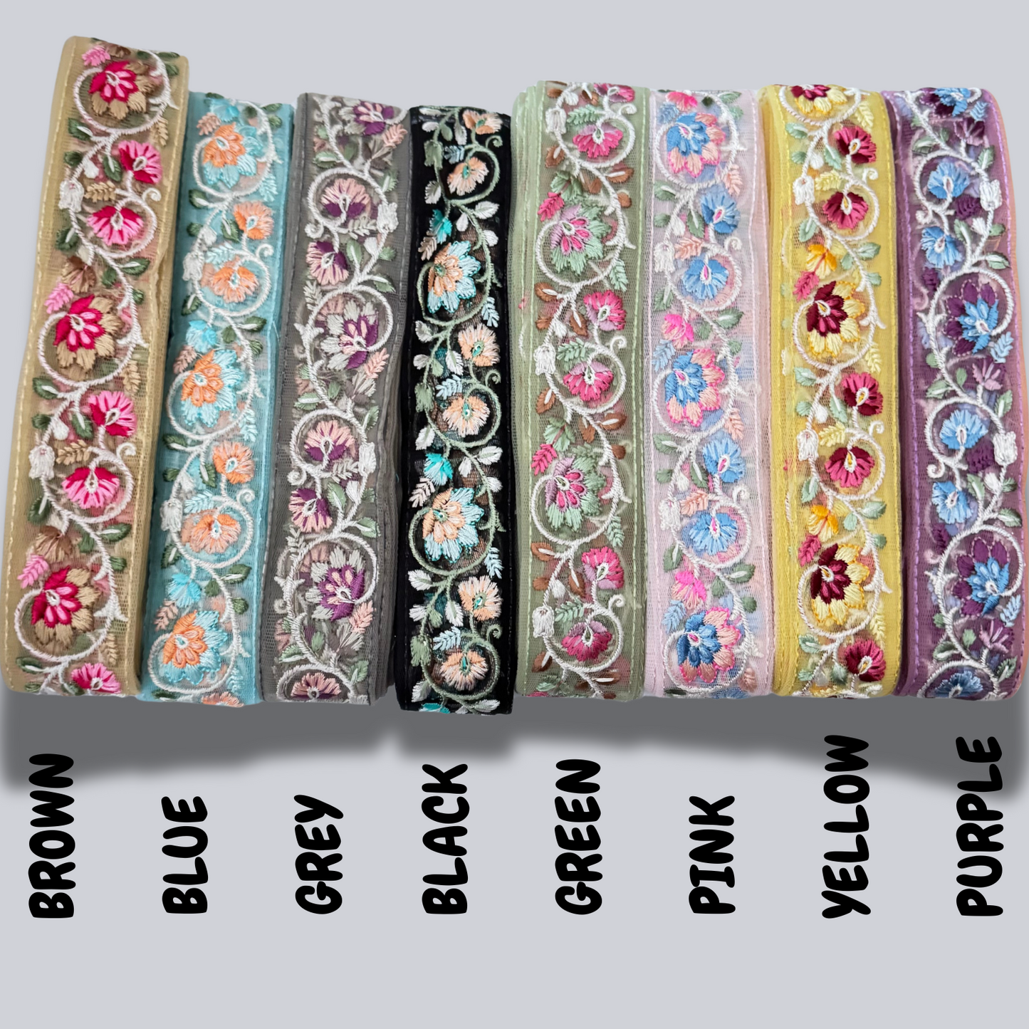 Assorted colours of floral embroidered net trim displayed with colour names.