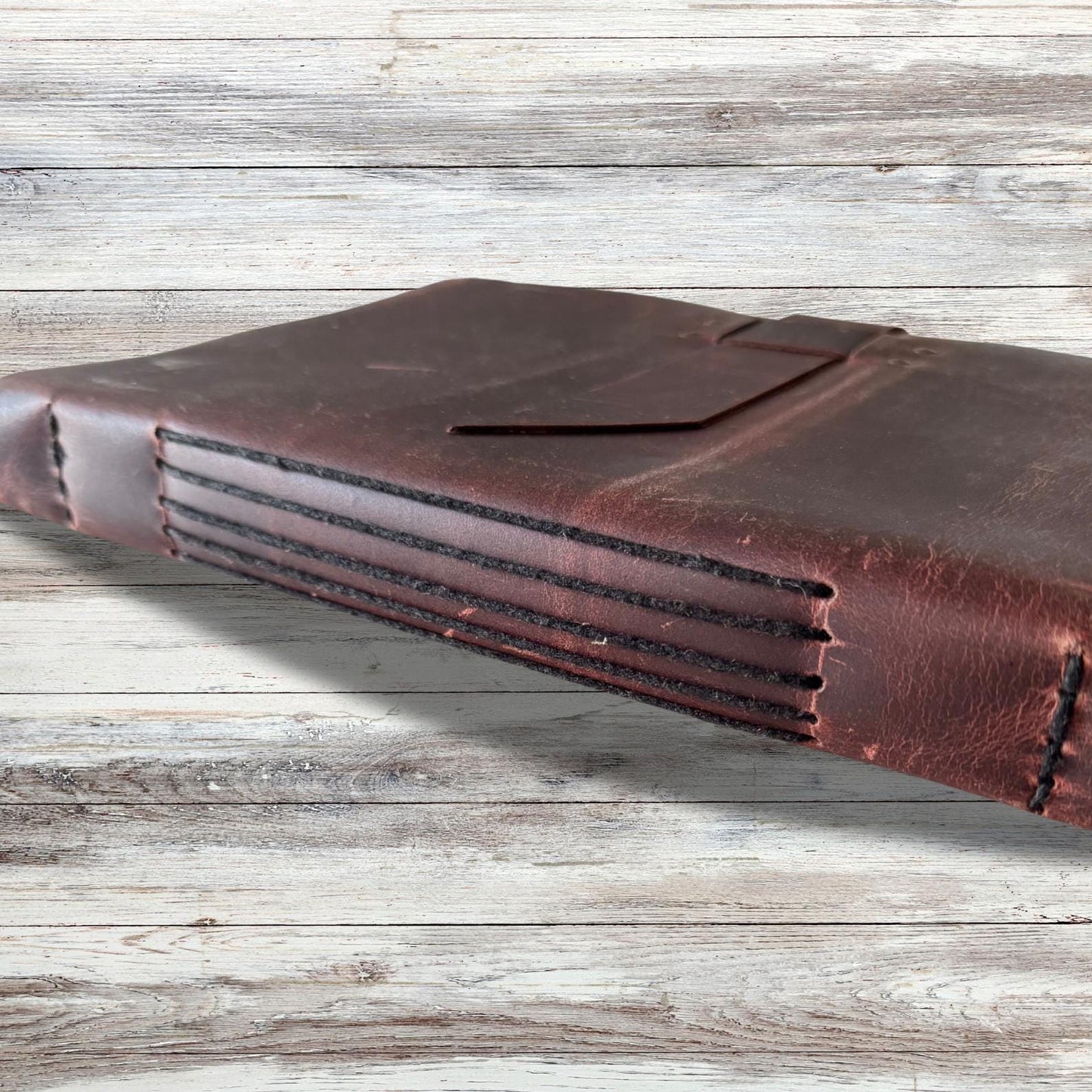 Leather-bound sketchbook for artists on an asthetic background.