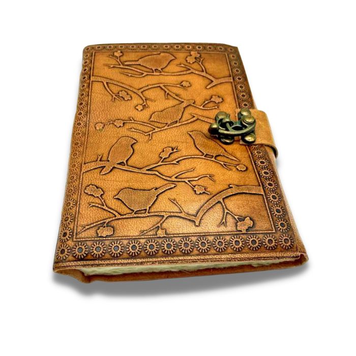 Leather journal travel on a white background with bird embossed design.