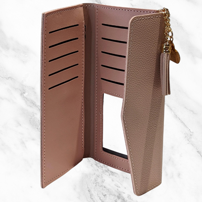 Pink leather wallet trifold standing tall on a white background