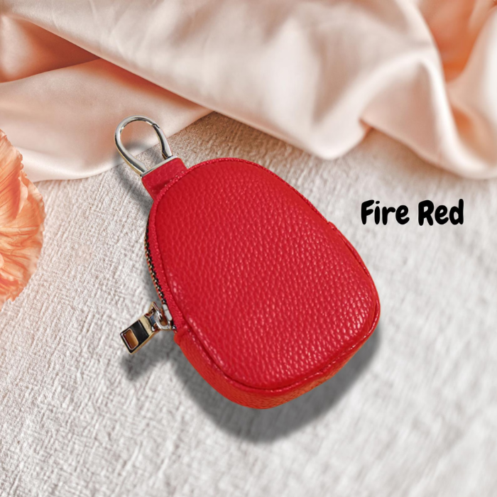 Lume Coin case in fire red on an asthetic background
