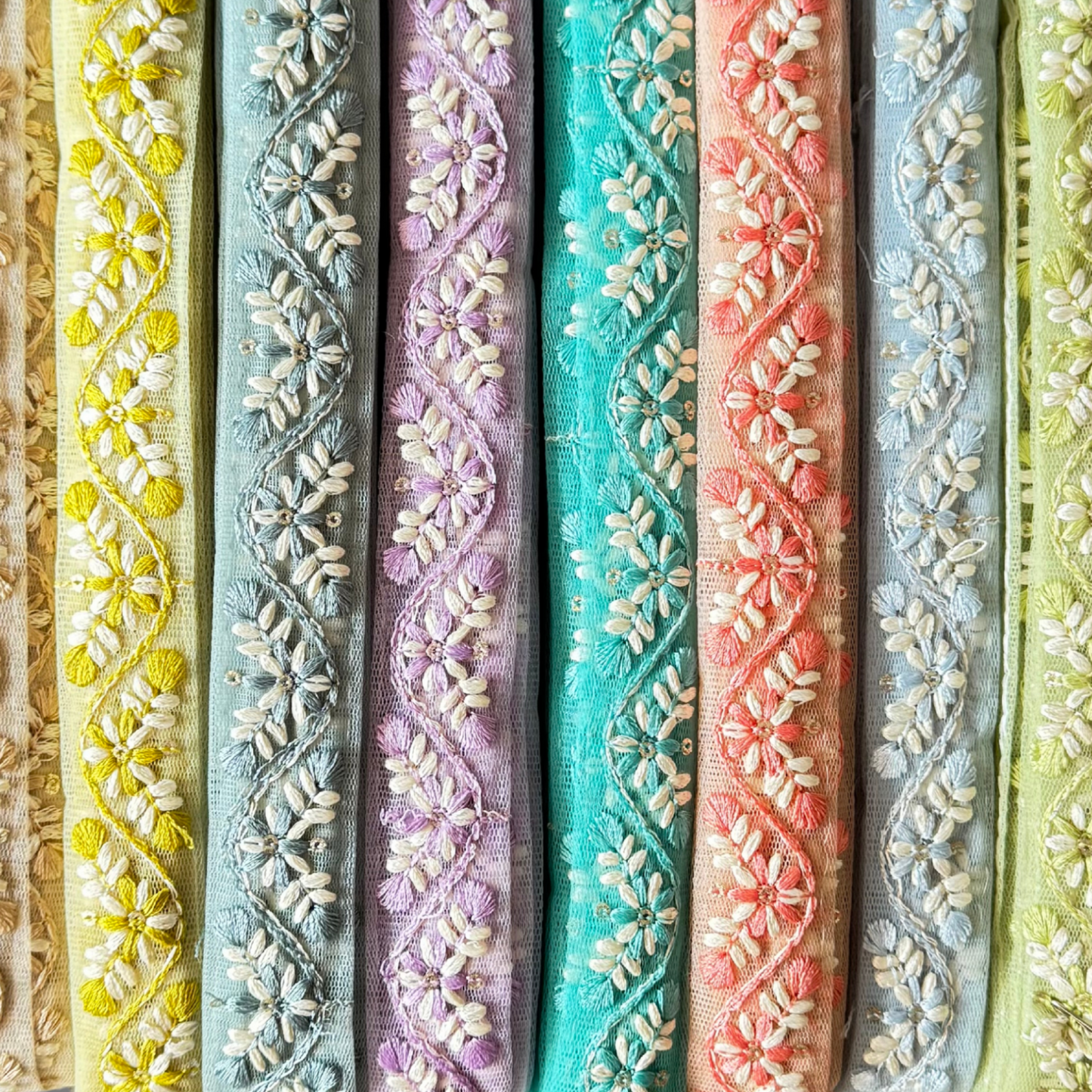 Net trim floral design close up in different colours