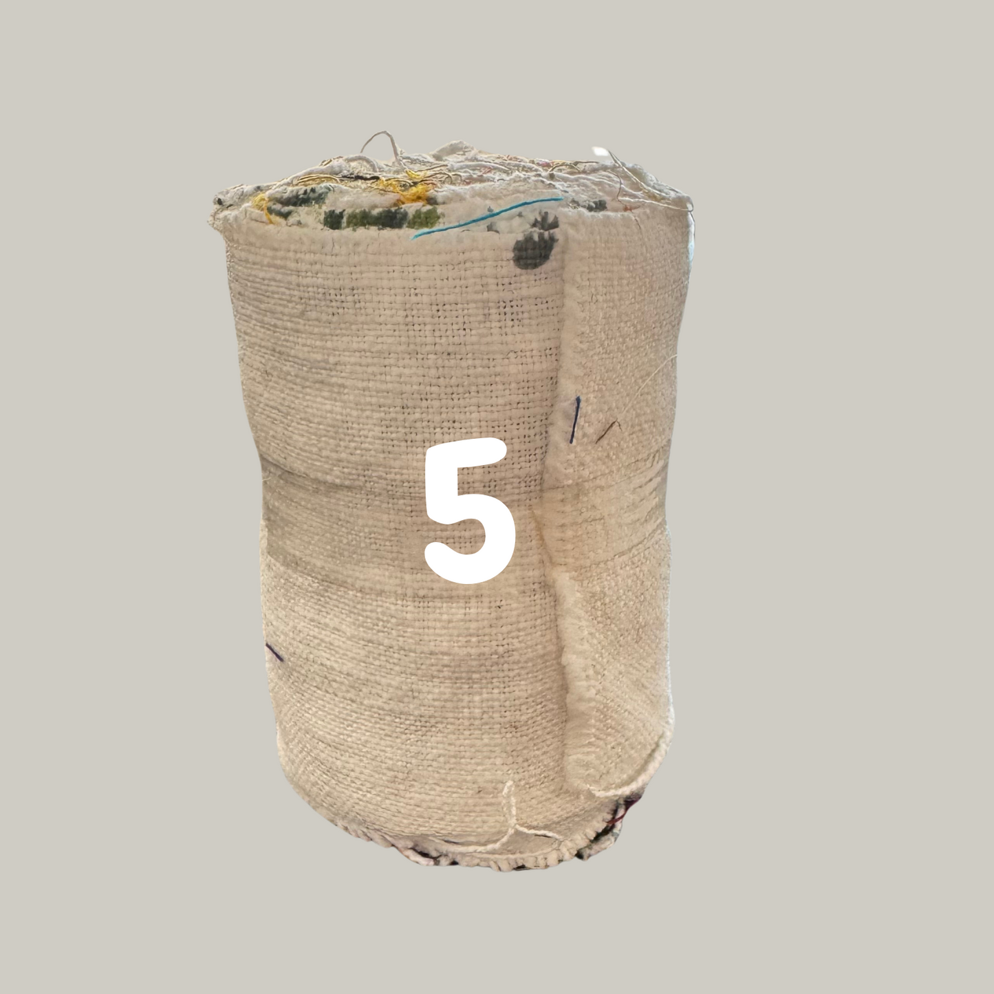 Orlia linen fabric rolls on a grey background