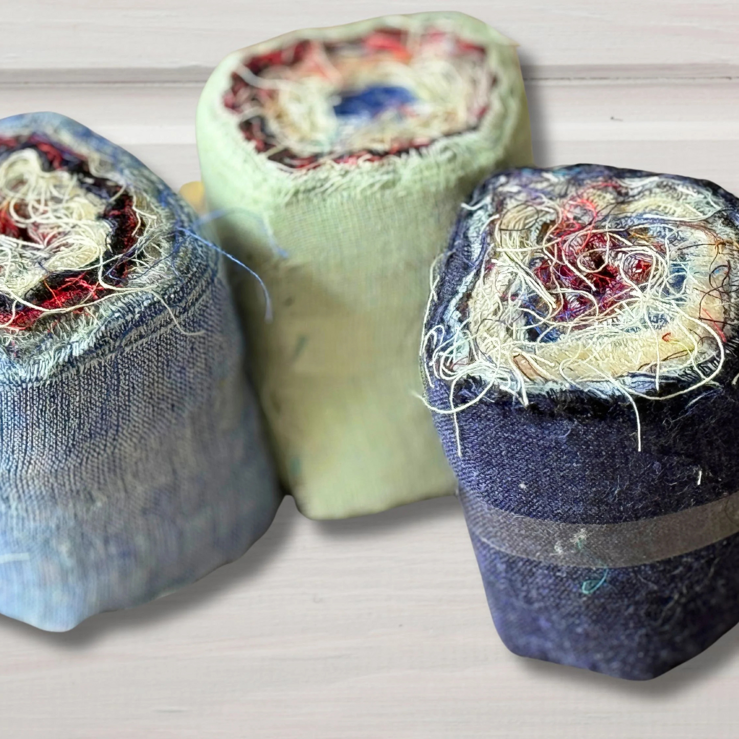Orlia rolls of linen on a grey background