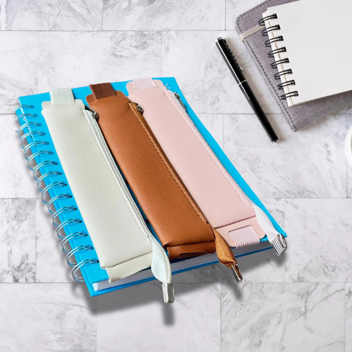 Personalised pen holder for journal placed on a table