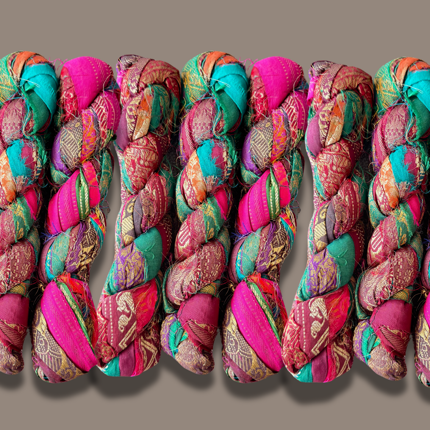 Recycled Bohemian silk fabric Ribbon on a grey background