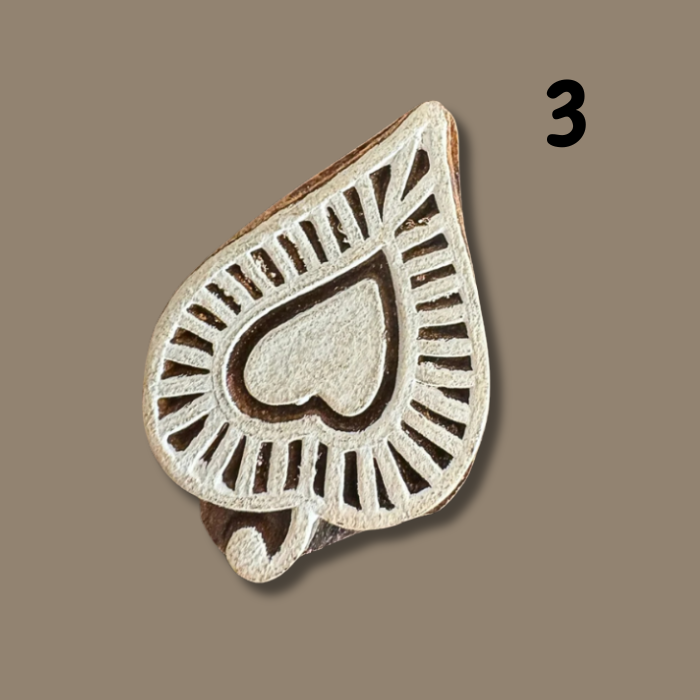 Wooden printing block on a beige background