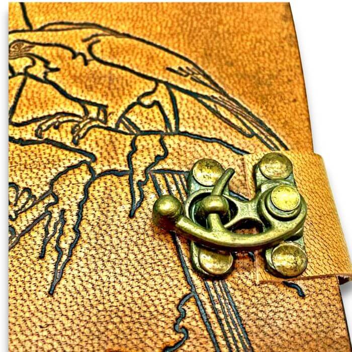 Close up of bird journal book showing closeup of brass lock
