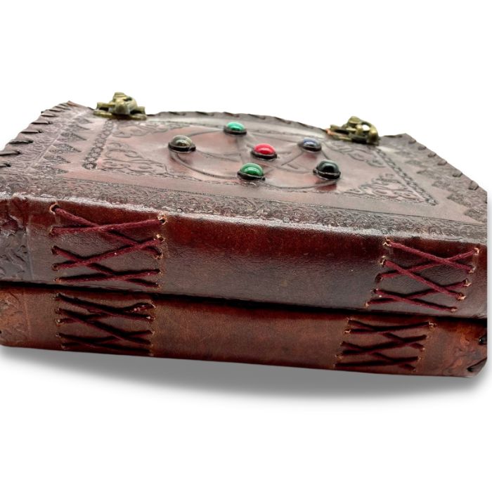 Kai leather bound travel diary with hand stitching showing on the side of the journal