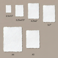 Six sizes of white 300 GSM handmade deckle edge cotton paper laid flat on taupe background — 2.5x3.5", 3.25x4.75", 4.25x6", 5x7", A5 and A4 — for DIY wedding invitations and stationery, Australia