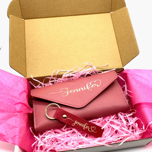 Vibrant Fuchsia Personalised leather wallet and leather keychain beautiful packed in a gift box with pink tissue paper and tissue shreds.