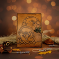 Brown leather-look journal with embroidered eagle on front cover and metal latch
