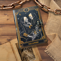 Dark blue book of shadows with gold illustration and “The Lovers” label, front clasp.