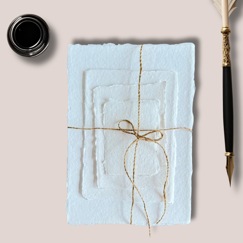 Light blue textured calligraphy sheet wrapped with gold string