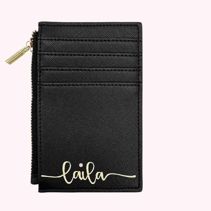 Black personalized card wallet with gold zipper and script name on front