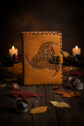 Celtic leather journal with embossed knot cover and metal button clasp, brown