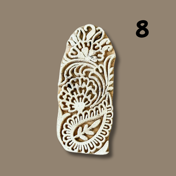 Elva wood printing block on a beige background