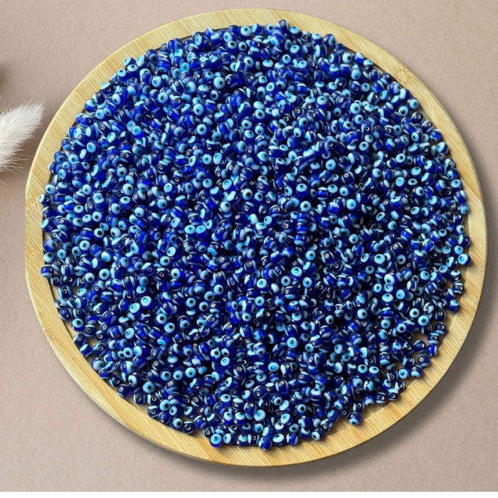  Evil Eye beads on a round dish used for jewellery making etc.