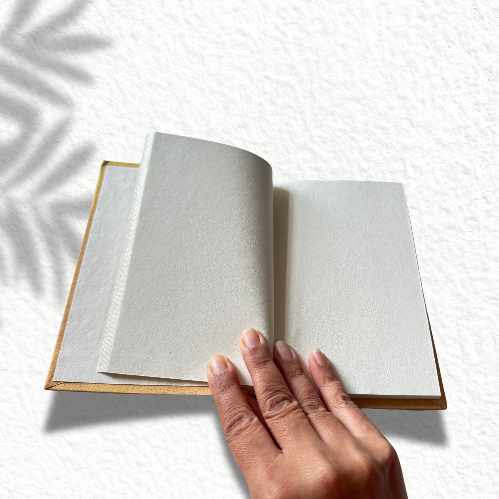Handmade notebook on an asthetic white background