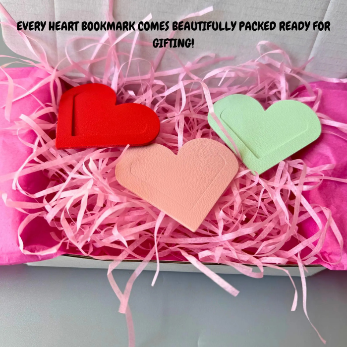 Heart corner bookmarks in a gift box with pink shredded paper, including red and mint heart tabs.