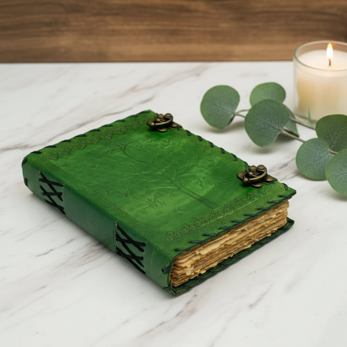 Green leather journal with tree of life embossing, brass clasp and stitched edges