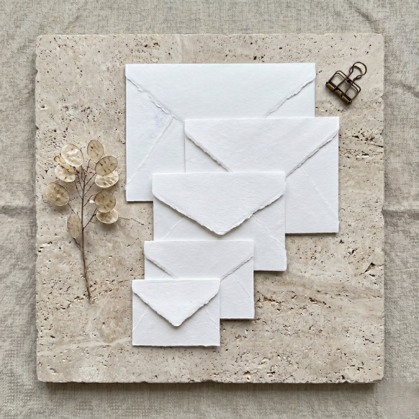 Handmade paper envelopes with natural deckle edges, ideal for wedding invitations and calligraphy addressing in Australia.