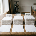 Handmade white cotton deckle edge paper sample pack showing 150 GSM, 250 GSM and 300 GSM paper weights — perfect for calligraphy, watercolour and DIY wedding stationery, Australia
