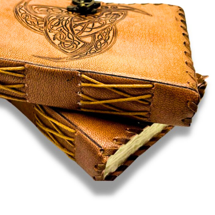 2 Leather grimoire journal placed one on top of the other.