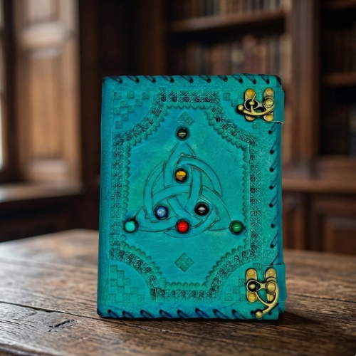 Teal handmade journal with embossed Celtic cat face and bronze corner clasps