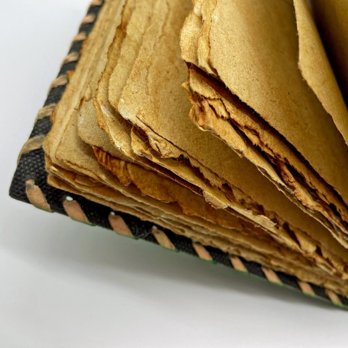 Milo leather sketchbook showing vintage deckled edge handmade papers