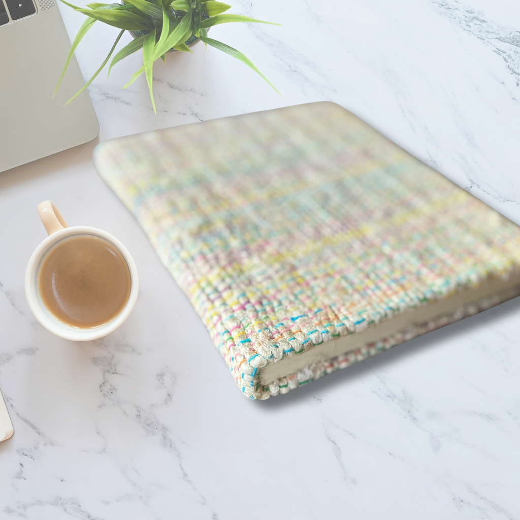 Notebook Journal on a table with coffee and a laptop on the side