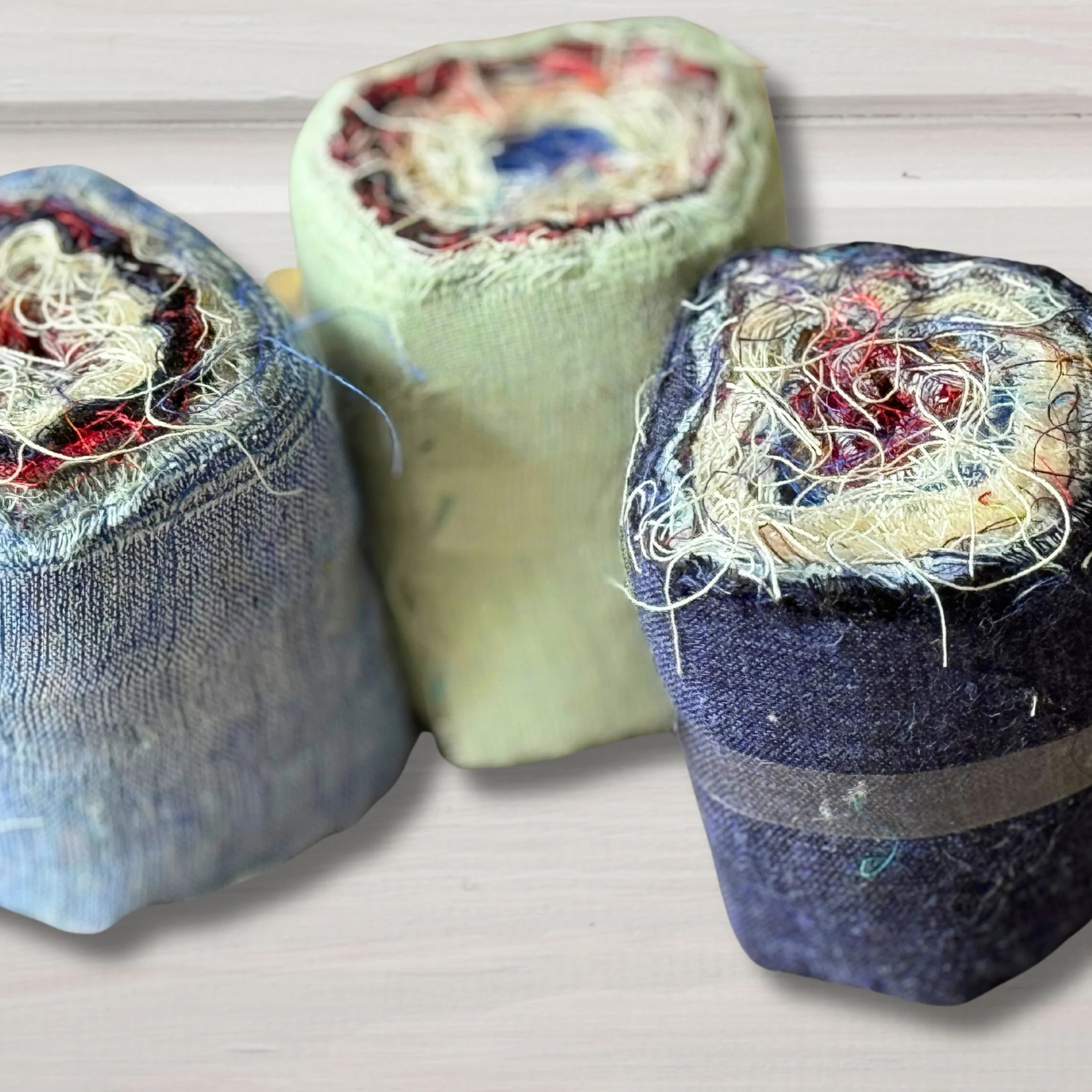 Orlia rolls of linen on a grey background