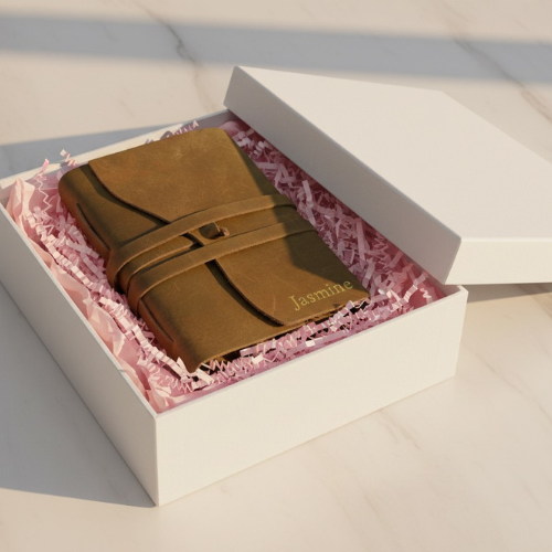 Premium personalised leather journal presented in a white gift box with pink tissue paper – perfect anniversary gift or graduation gift for her.