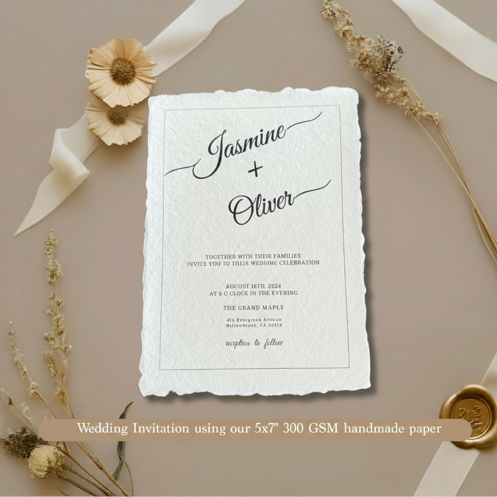 Wedding invitation for Jasmine and Oliver printed on white 300 GSM handmade cotton rag paper 5x7 inch with natural deckle edges, styled with dried flowers, white satin ribbon and gold wax seal on taupe background