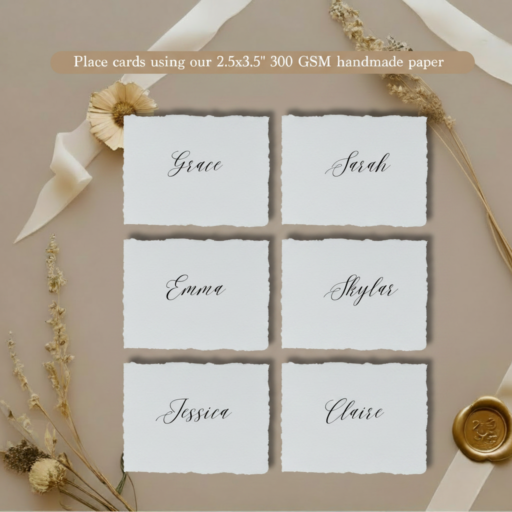 Six wedding place cards with calligraphy guest names printed on white 300 GSM handmade cotton rag paper 2.5x3.5 inch with natural deckle edges, styled with dried flowers and white satin ribbon on taupe background