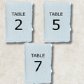 Light blue wedding table number card with "TABLE 2" in black lettering