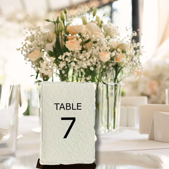 Wedding table name place cards displayed on a wedding table
