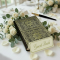 Wedding guest book with dark cover and ornate gold floral border pattern, hardbound.