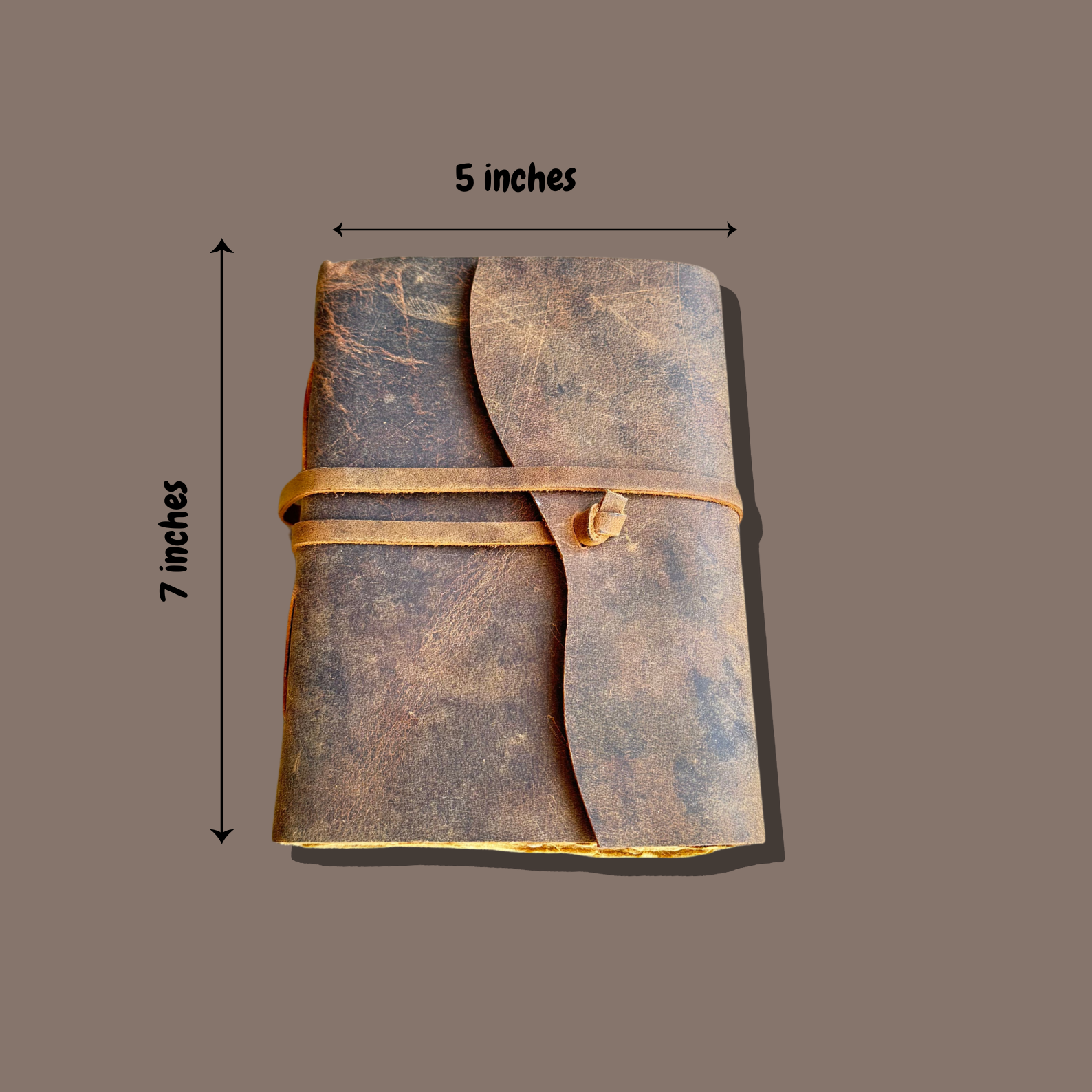 leather journal personalized on a brown background with measurements of the leather journal 5x7 inches.