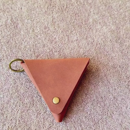 a video showing the use of the brown Mini Coin Purse to store small essentials like coins etc. 