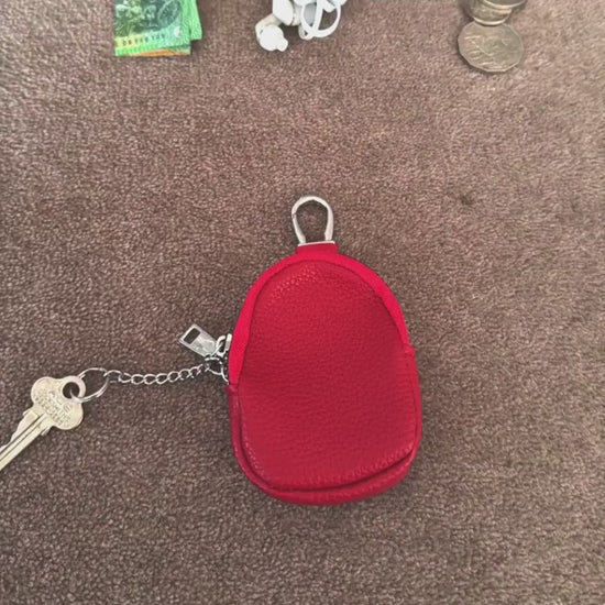 A video showing mini leather coin purse in use