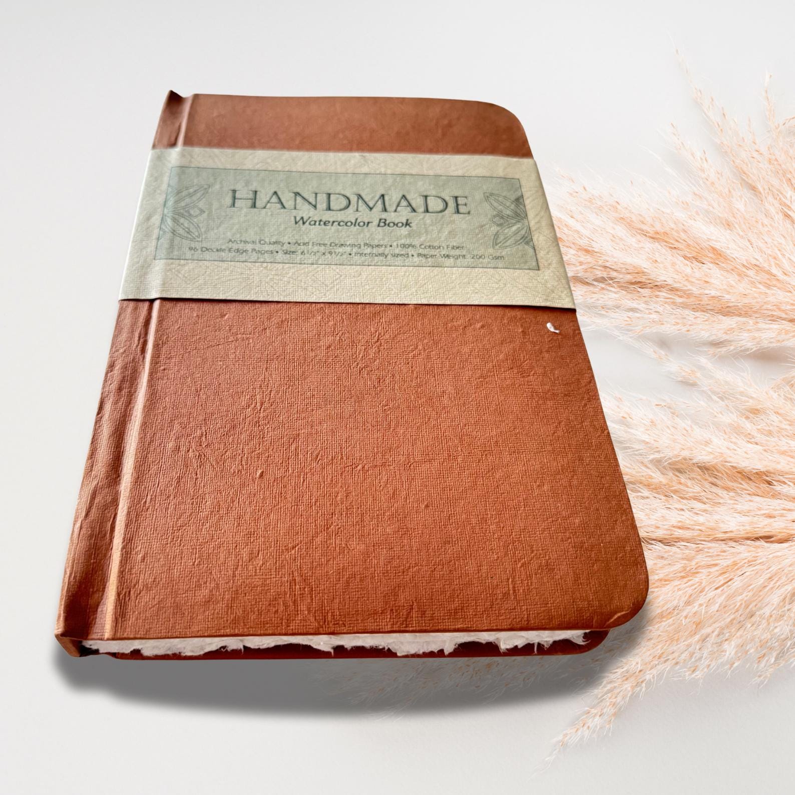 Watercolour book on a simple white background