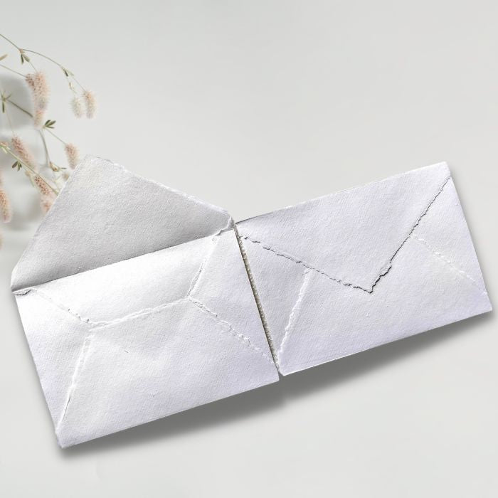 Handmade C5 envelopes, pair in white with overlapping flaps and stitched lines